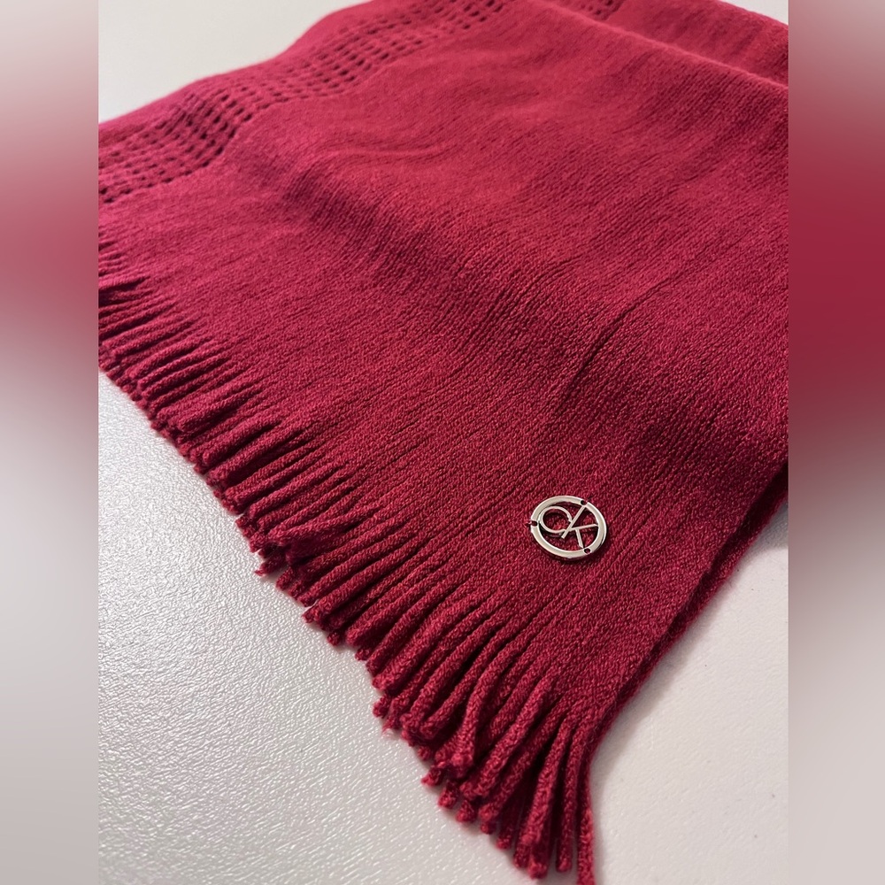NWOT.  Calvin Klein burgundy knit scarf with 1” fringe.